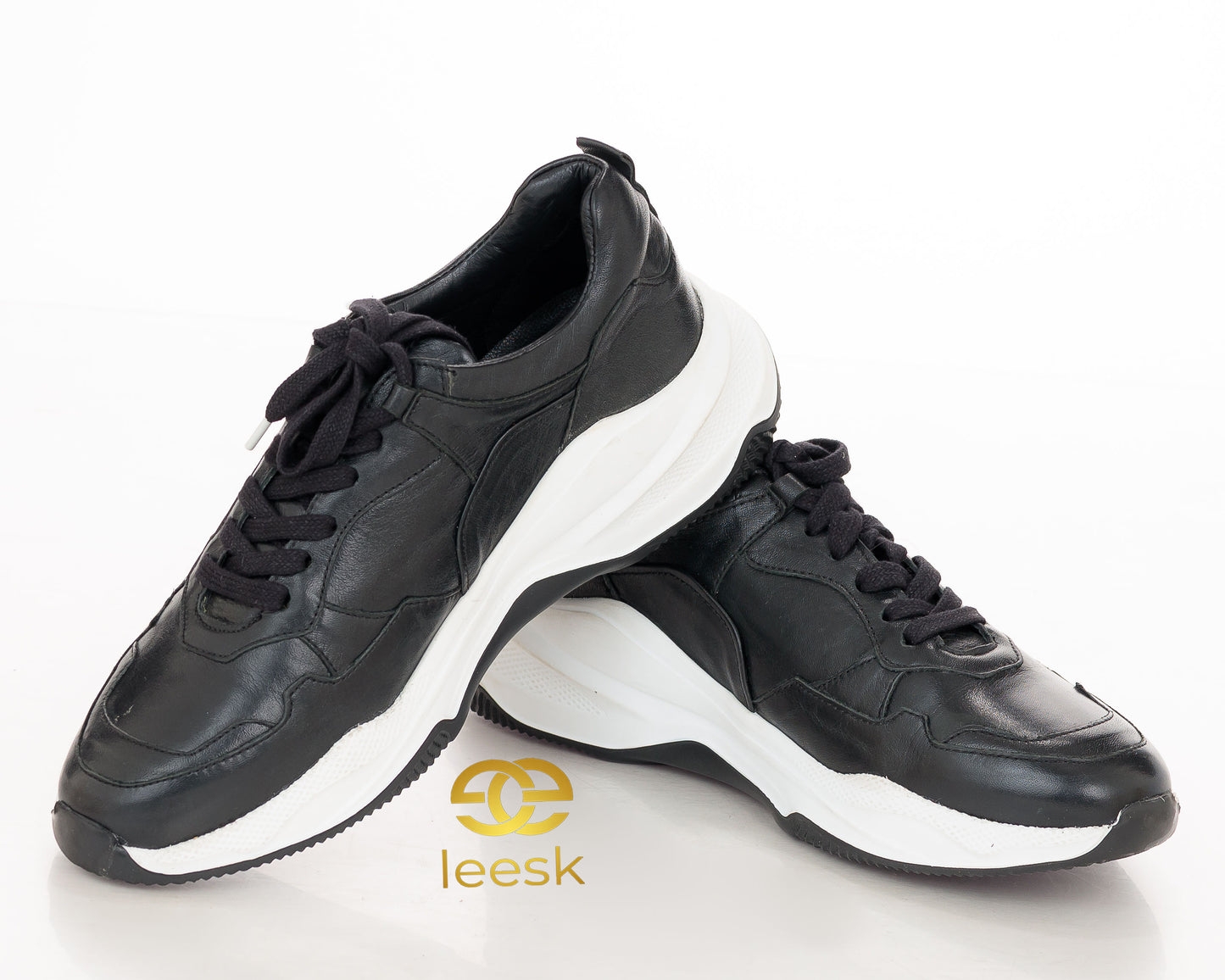The Urban Motion Sneaker — Black Leather (Khube)